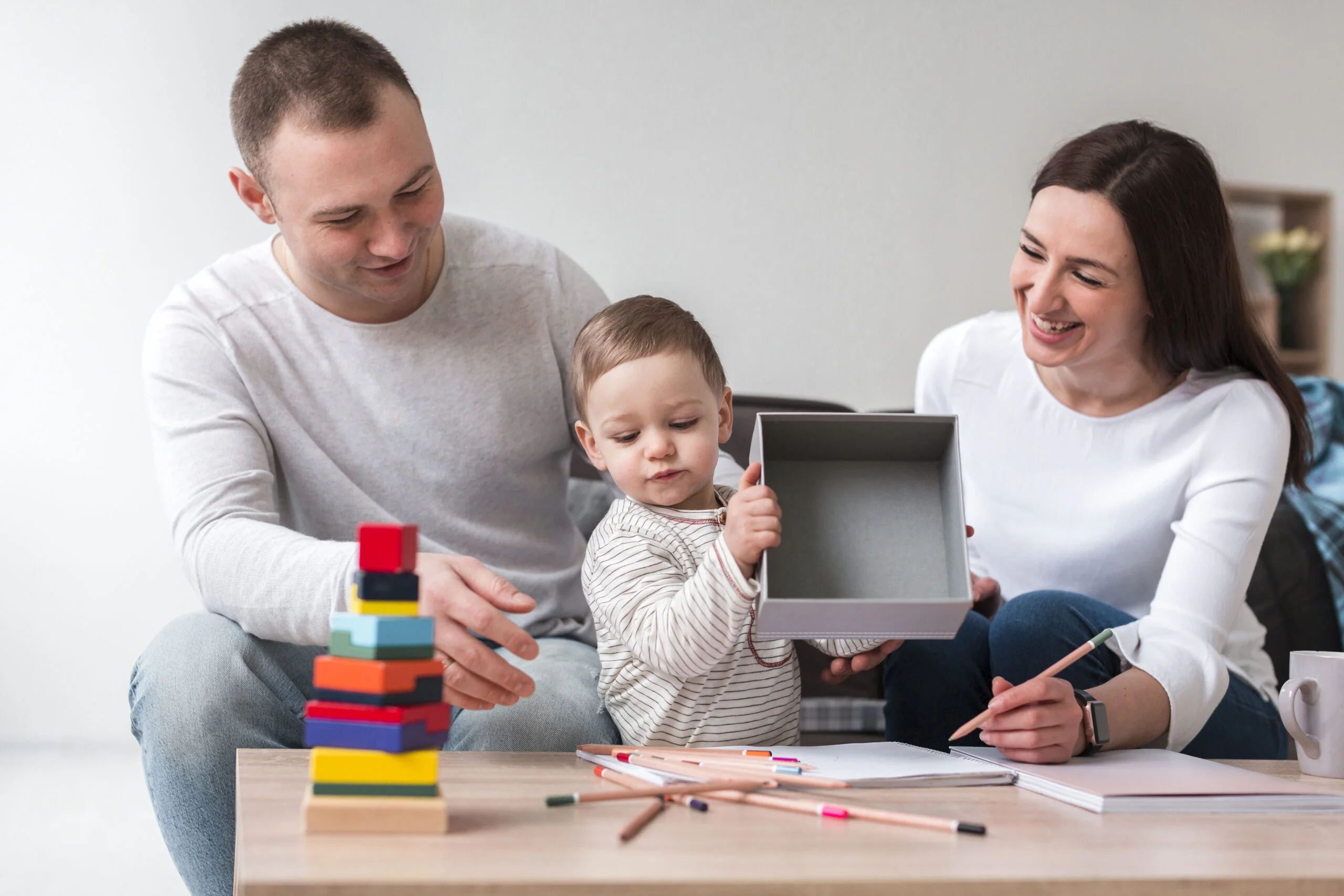 front-view-mother-father-with-child-home-1