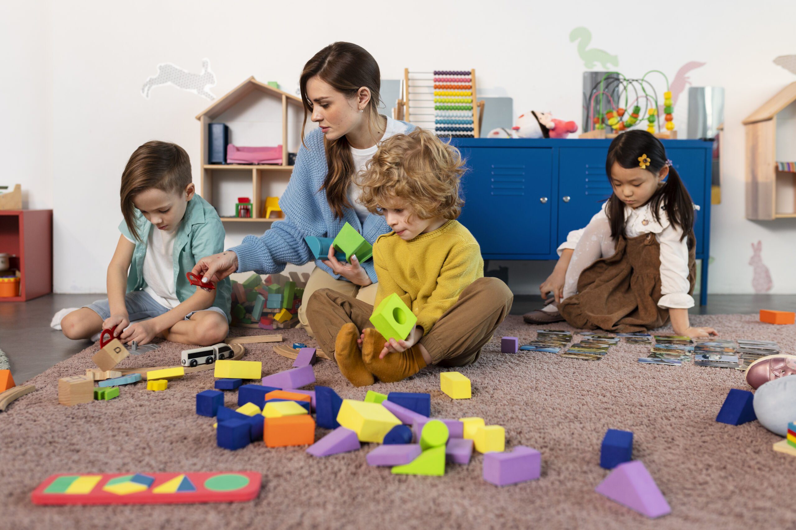 full-shot-little-kids-playing-together-floor-1