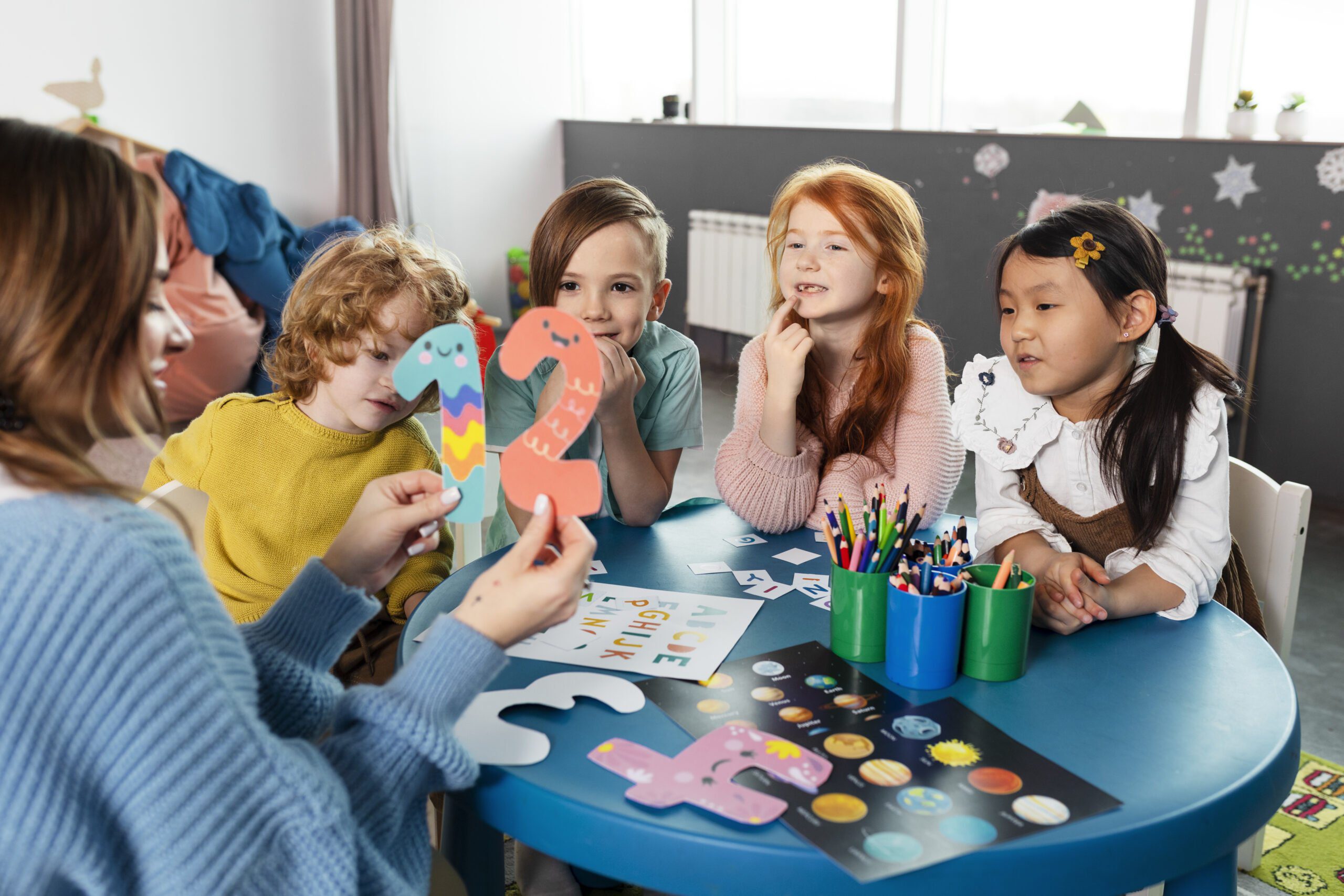 medium-shot-kids-sitting-together-table-1