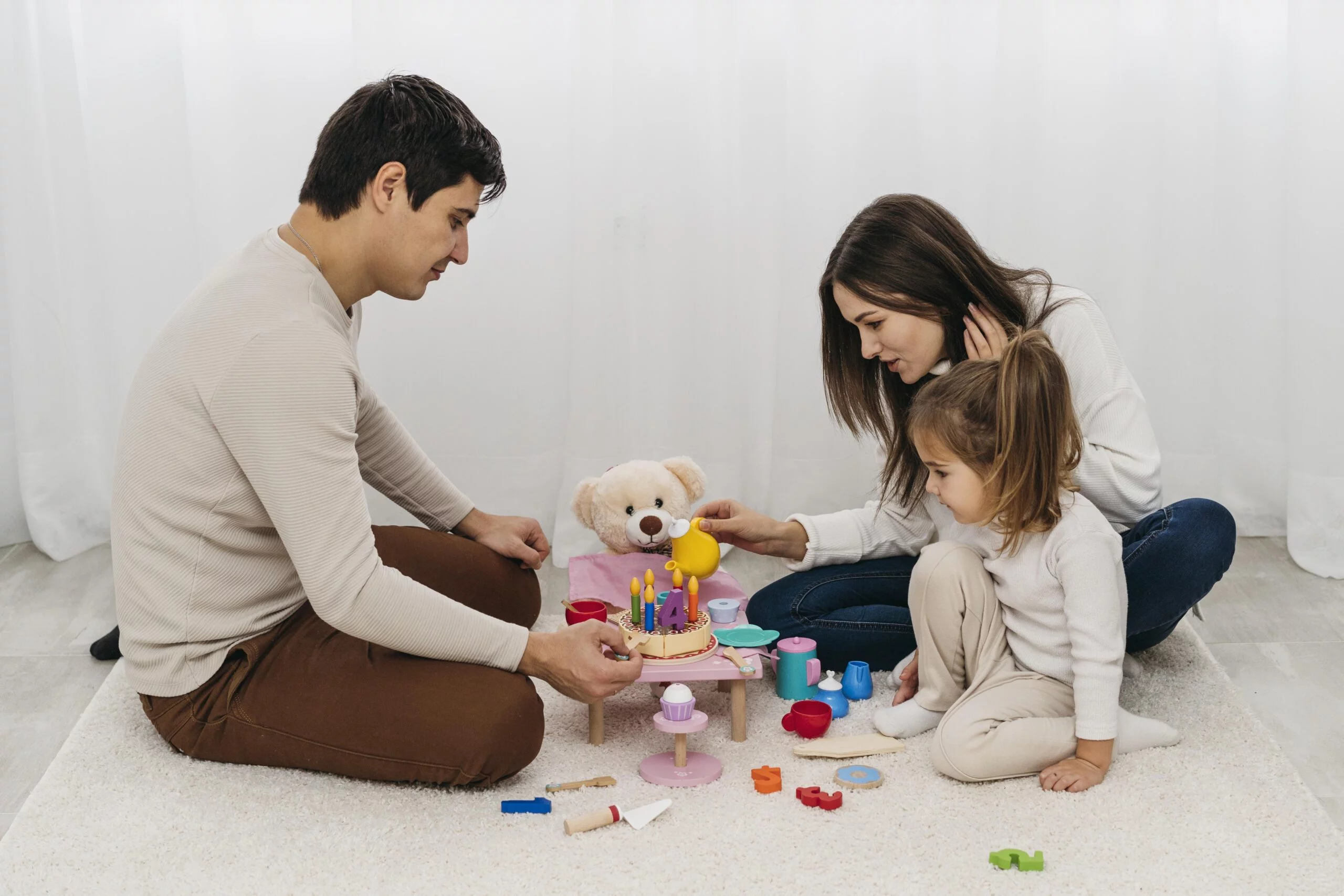 mother-father-playing-with-daughter-home-1