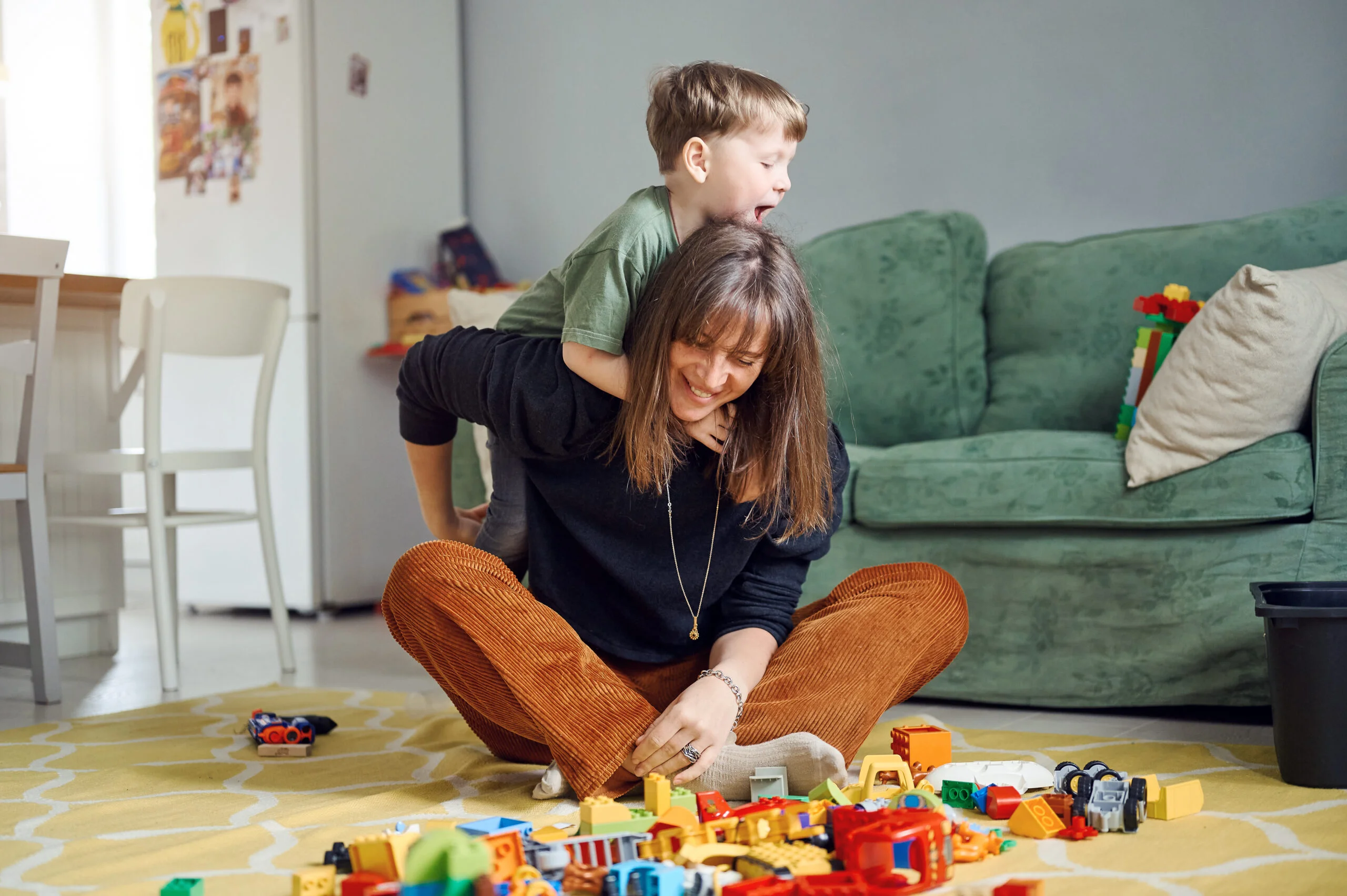 mother-with-children-embracing-having-fun-laughing-home-parent-with-sons-spending-time-together-1