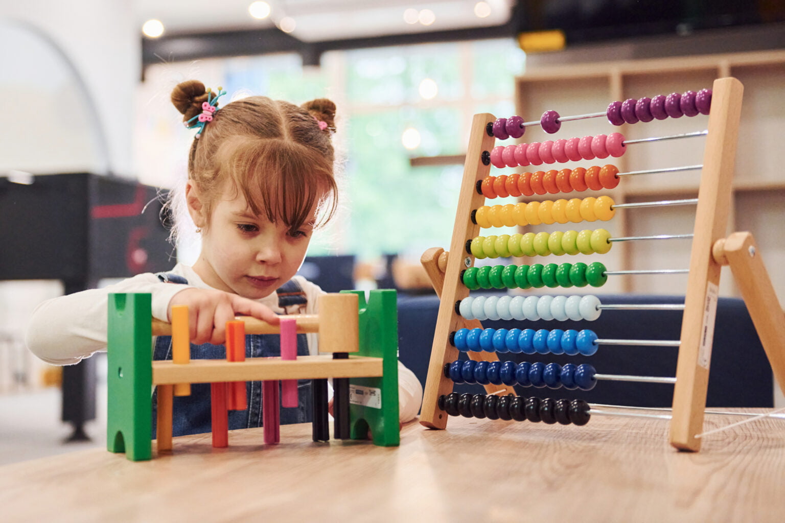 cheerful-little-girl-casual-clothes-playing-kindergarten-with-toys-1-1536x1024-1