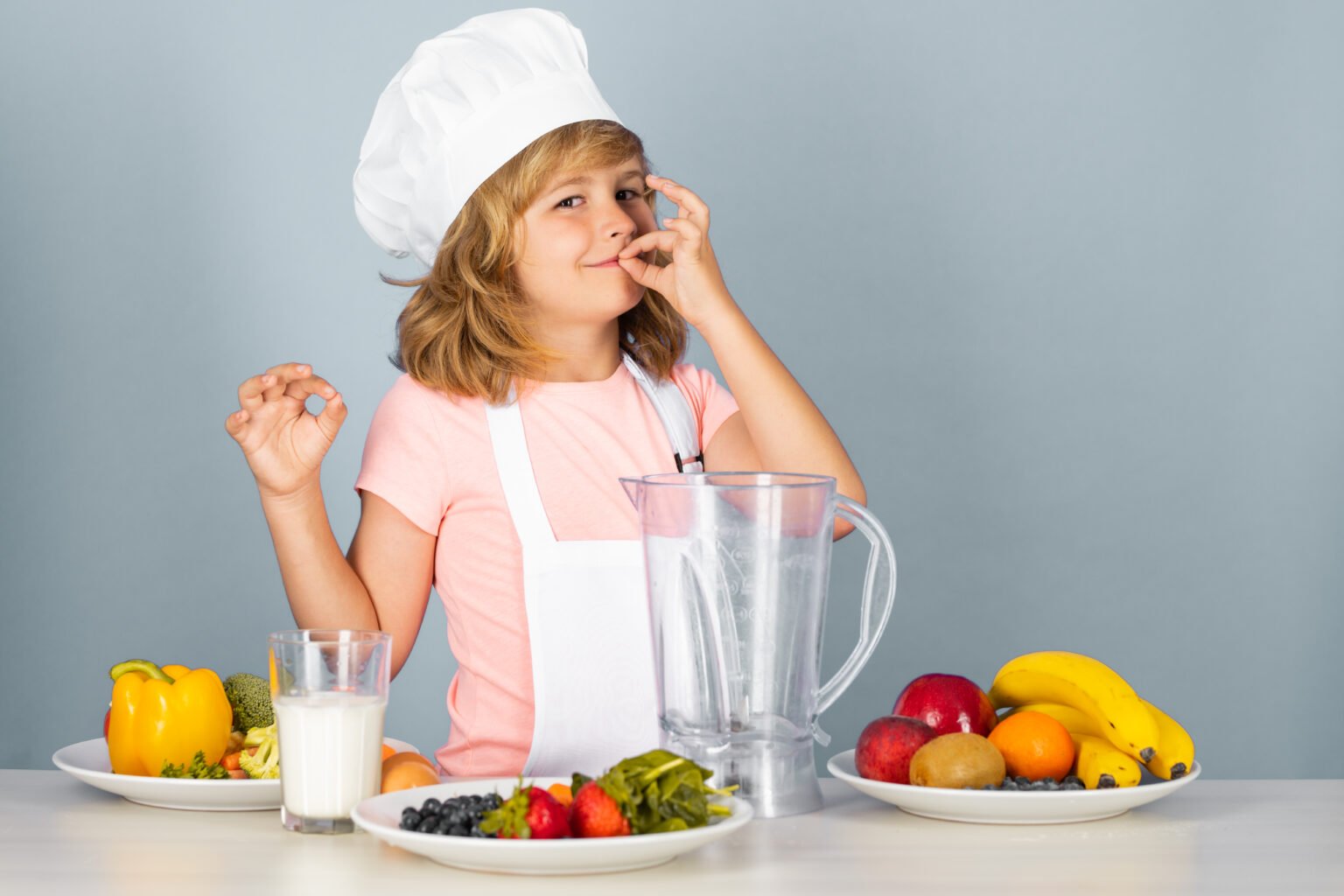 fruits-vegetables-kids-child-chef-dressed-cook-baker-apron-chef-hat-isolated-studio-b-1-1536x1024-1