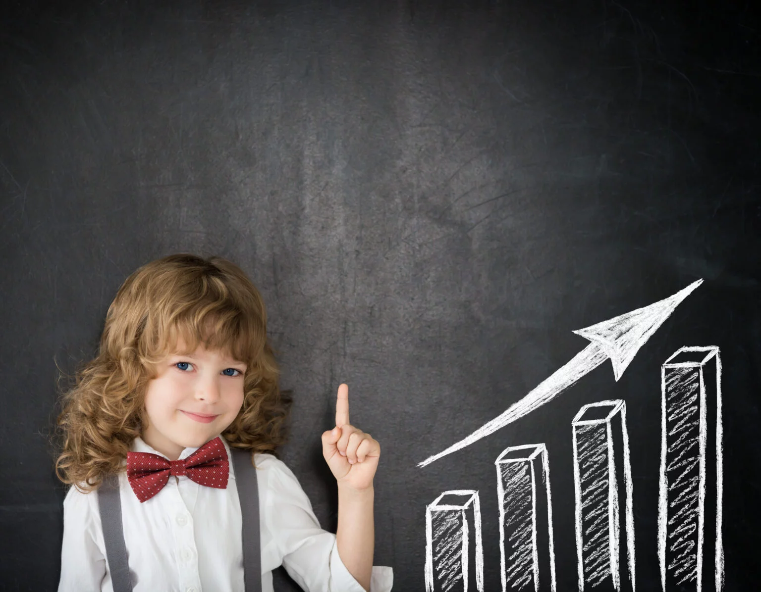 smart-kid-class-happy-child-against-blackboard-drawing-growth-bar-graph-business-concept-1536x1196.jpg