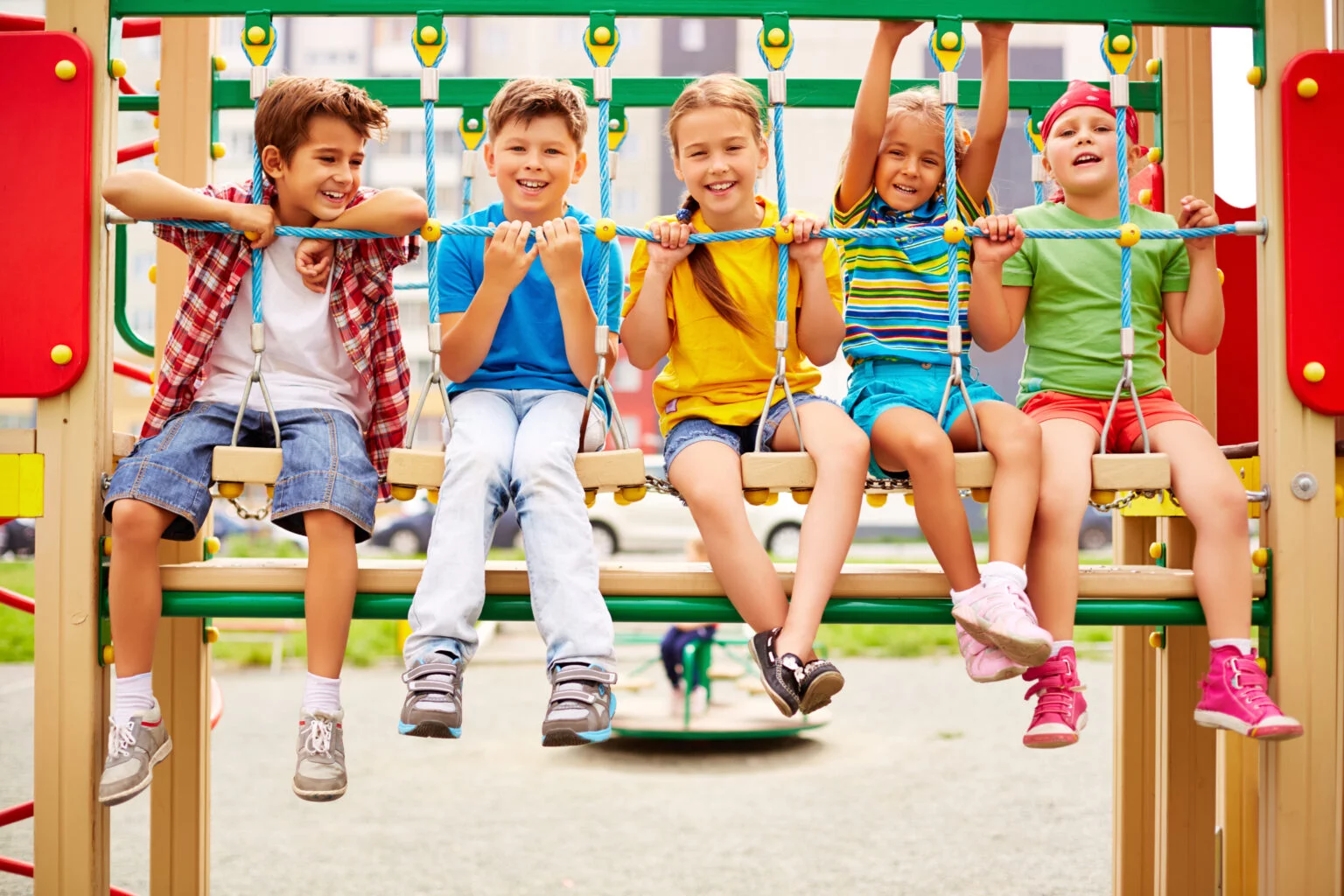 smiling-classmates-sitting-row-playground-1-1536x1024.jpg