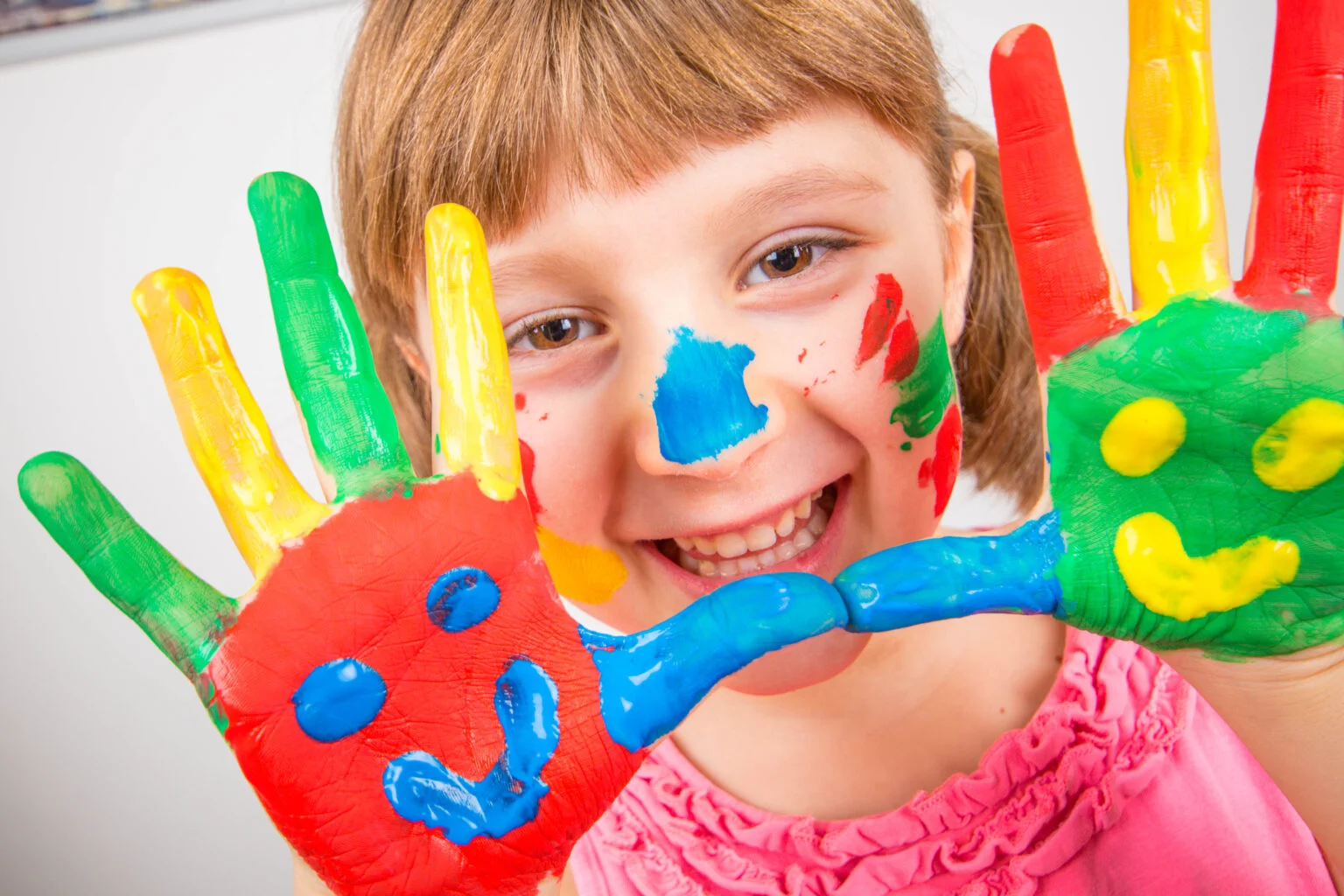 smiling-little-girl-with-hands-painted-colorful-paints-1536x1024.jpg